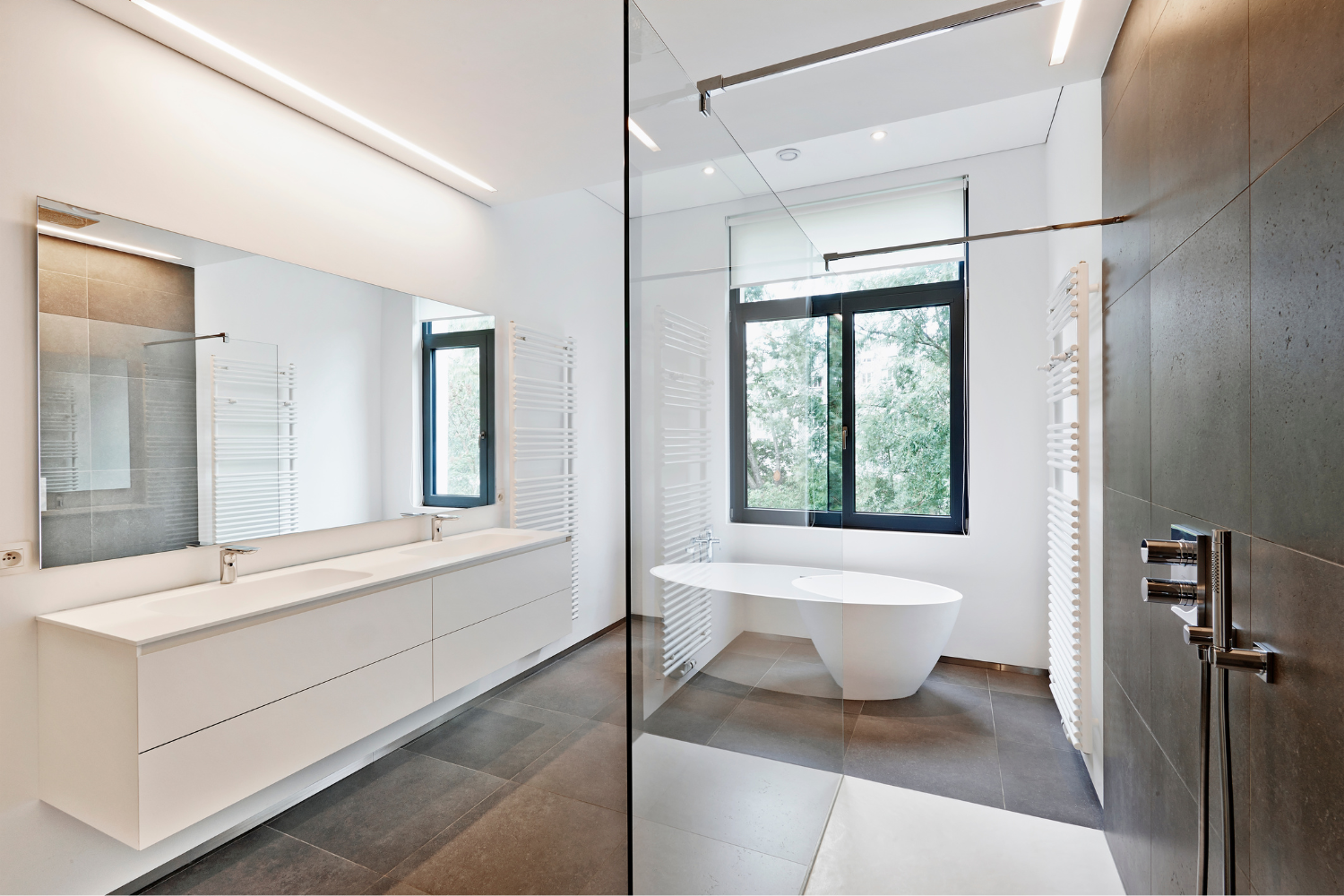 Luxury bathroom remodel with walk-in glass shower, soaking tub, and marble finishes in Las Vegas