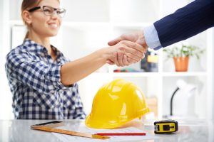 woman shaking a contractors hand