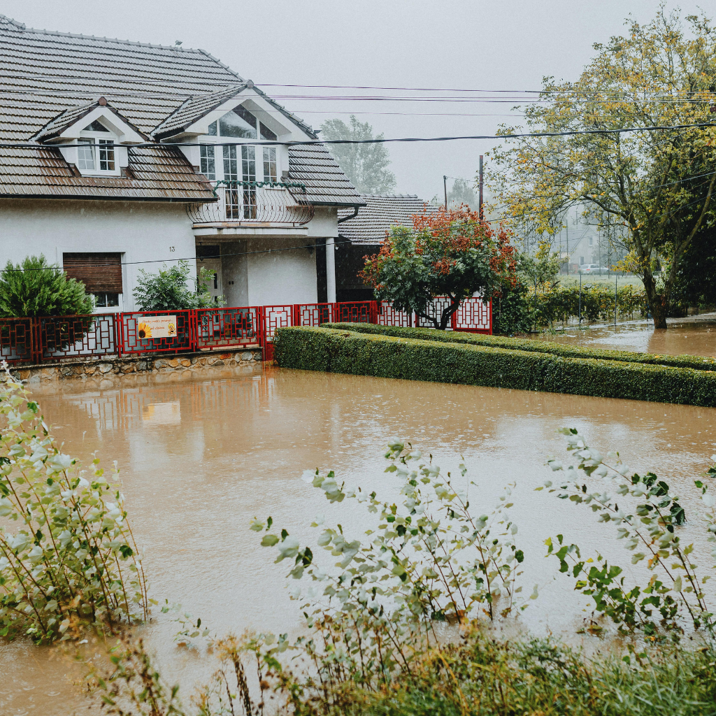 Technician extracting standing flood water from Las Vegas residence