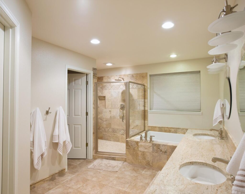 Elegant bathroom remodeling in Henderson, NV featuring custom tile work and walk-in shower installation