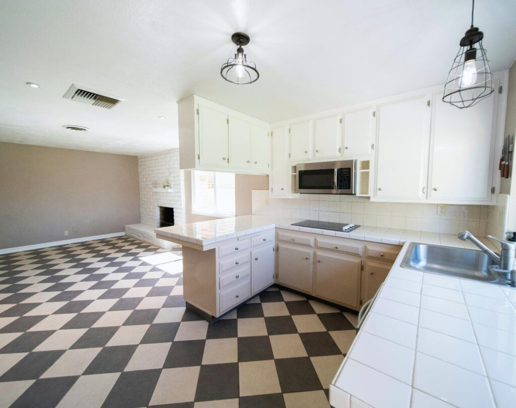 Kitchen remodeling near me in Anthem, NV featuring custom cabinetry and an upgraded cooking area
